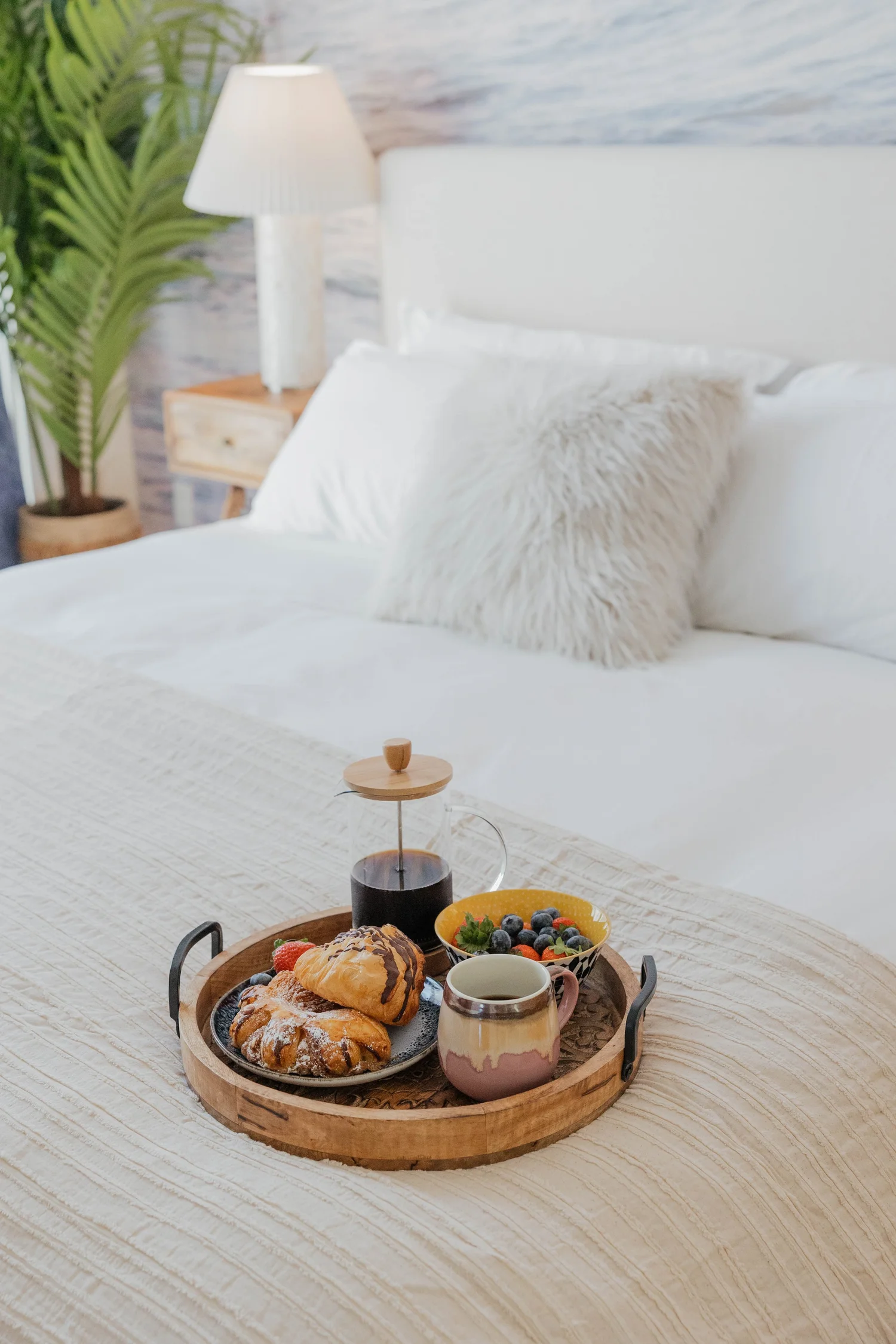 Bed at Velvet Surf in Pacific Beach, designed by Salt and Sky Lodging Co.