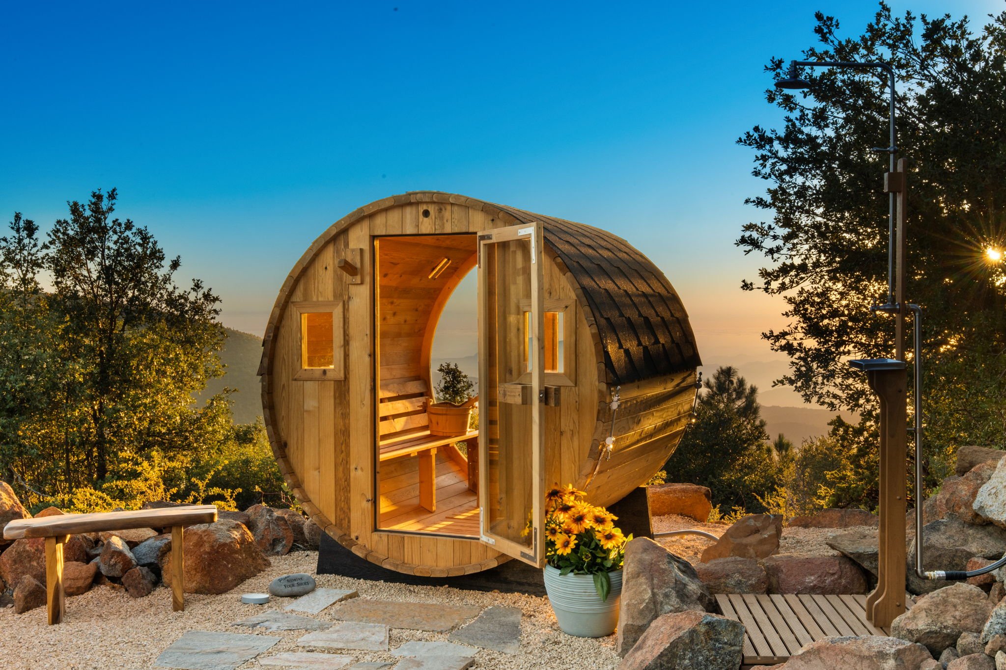 Inside the sauna, with glass doors facing the mountains at Restore Outpost, Wild Moon Ranch, Julian, designed by Salt and Sky Lodging Co.