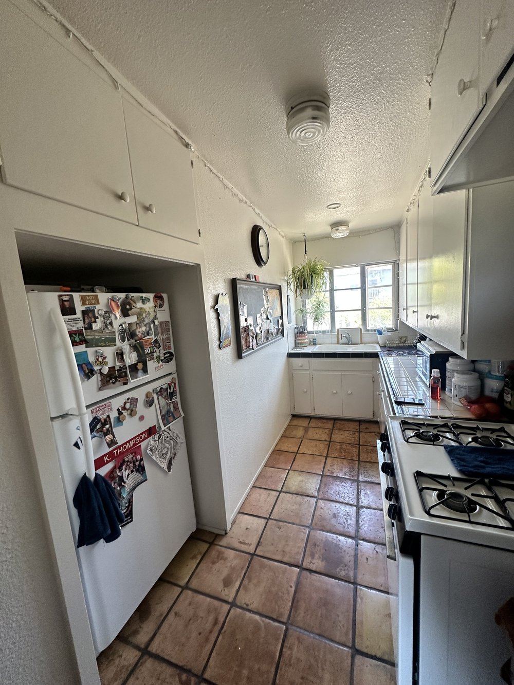 Before: Galley kitchen with the fridge at Clementine C in Oceanside
