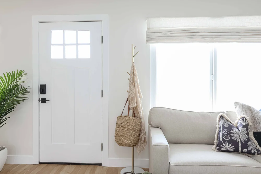 Hooks and a woven bag by the front door in Unit One at The Swell, Oceanside