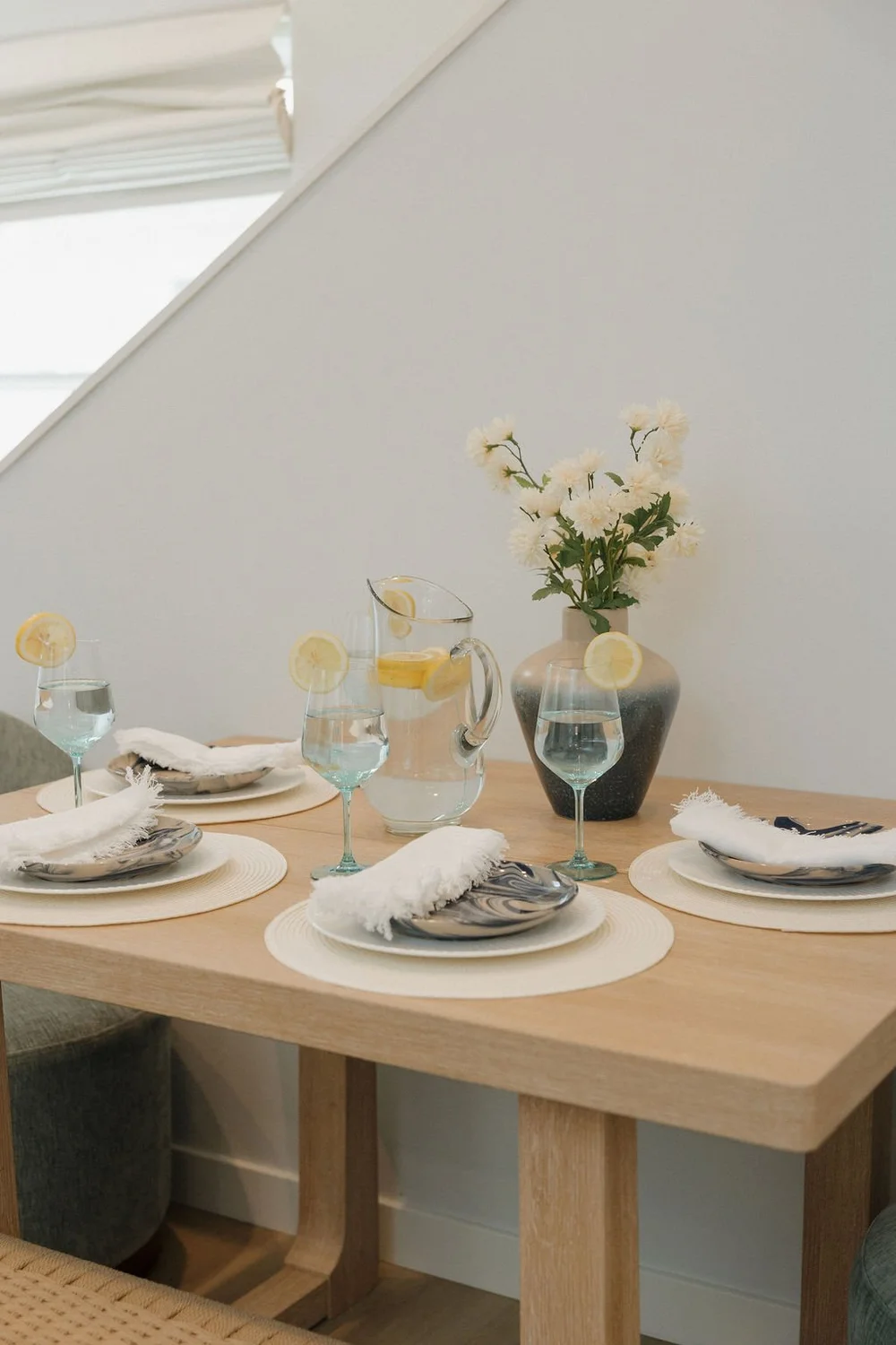 The dining table set for four in The East Cove townhome