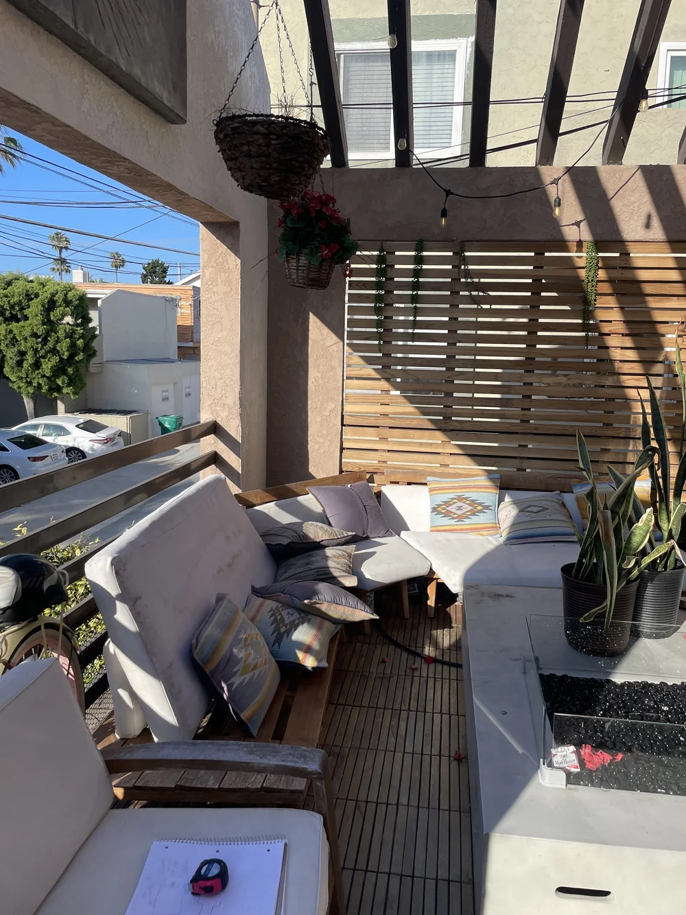Before: Covered patio with old furniture at Velvet Surf in Pacific Beach
