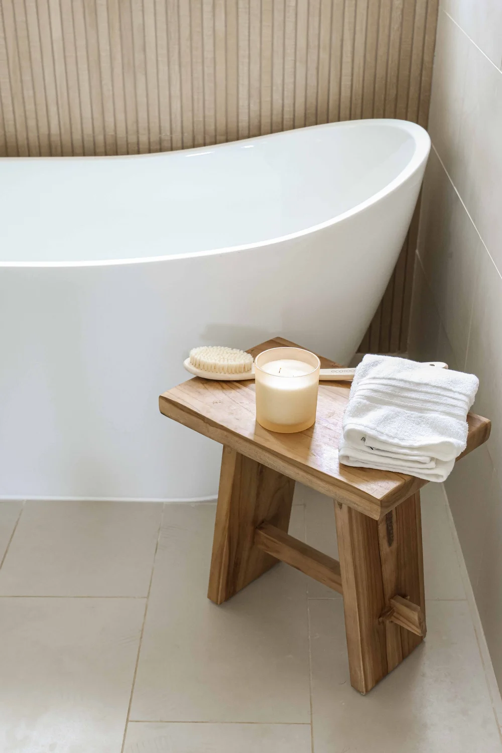 The soaking tub with a teak stool in Unit One at The Swell, Oceanside