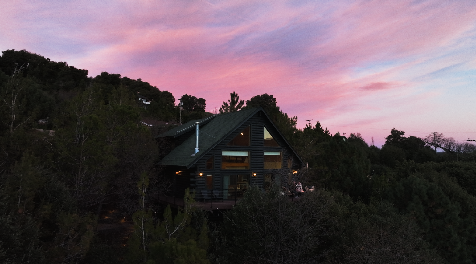 Dark Moon Chalet glowing at twilight in Julian, CA, a certified Dark Sky Community