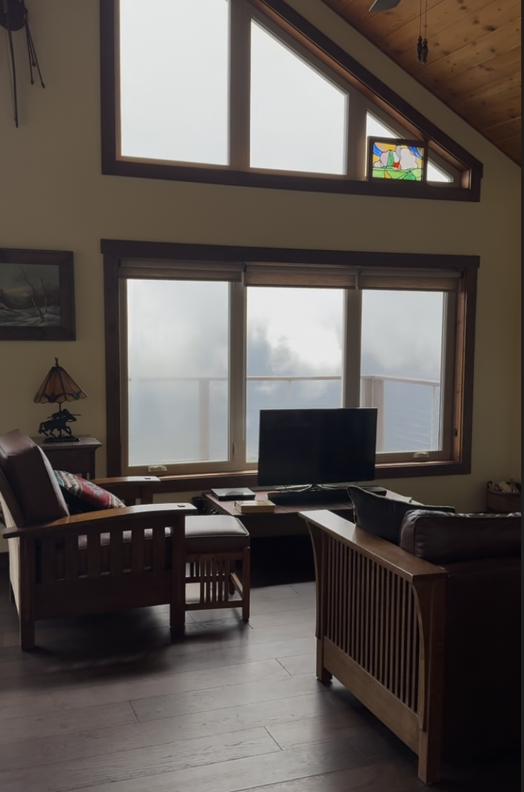 Before: living area with a TV and mission-style furniture