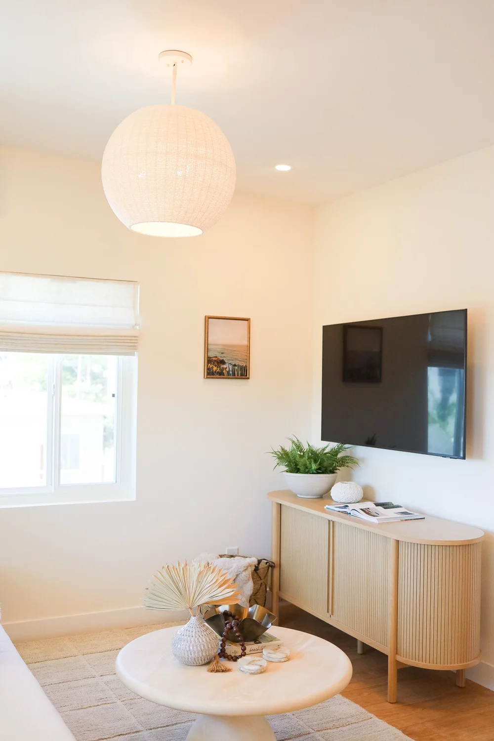 The living room with a TV console in Unit Three at The Swell, Oceanside