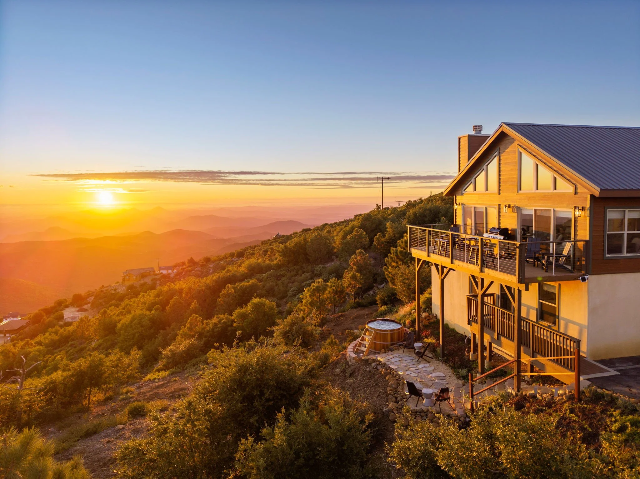 Wild Moon Ranch at sunset, a cabin on the ridge above the mountains near Julian, California