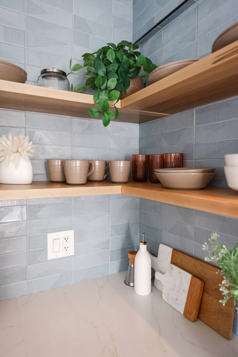 Corner shelves with copper cookware in Unit Two at The Swell, Oceanside