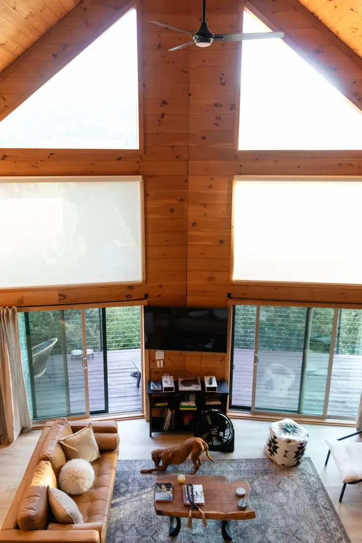 Guest photo: the great room and A-frame windows with the family dog