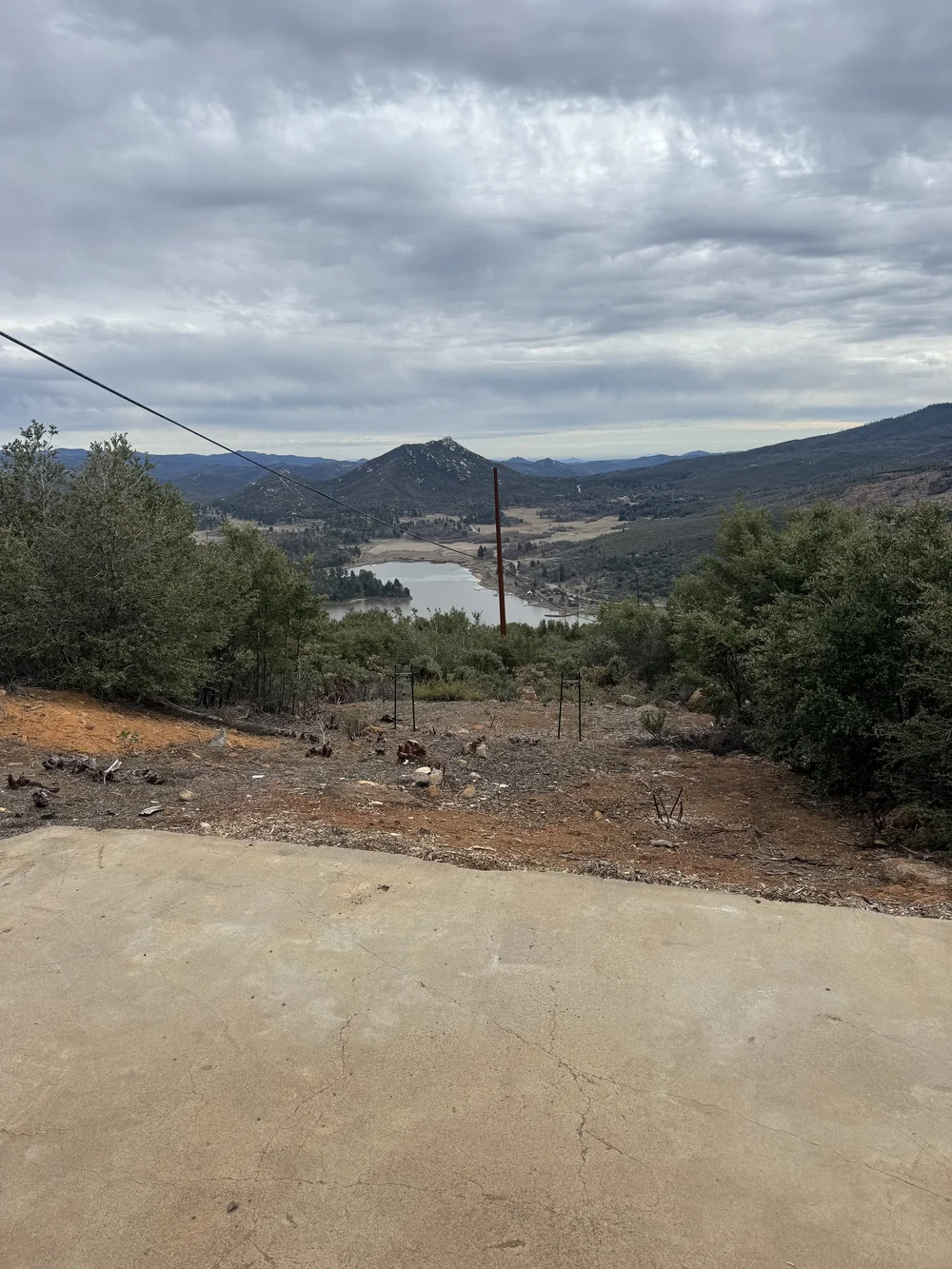 Before: bare dirt and concrete above the Lake Cuyamaca view at Restore Outpost, Wild Moon Ranch, Julian