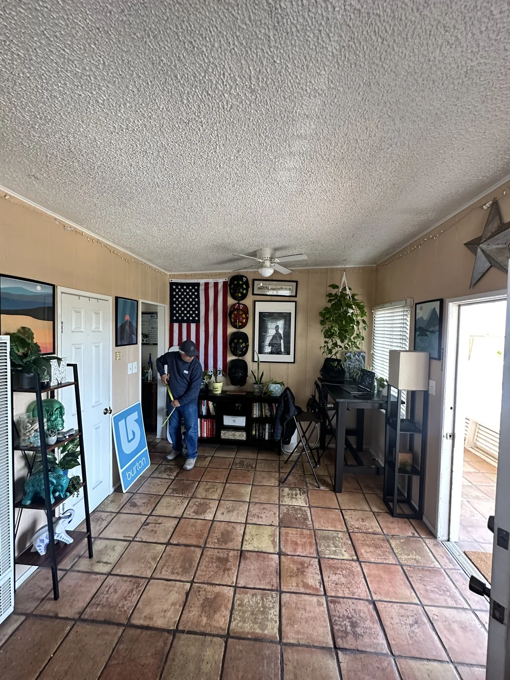 Before: Living room with a tile floor at Clementine C in Oceanside