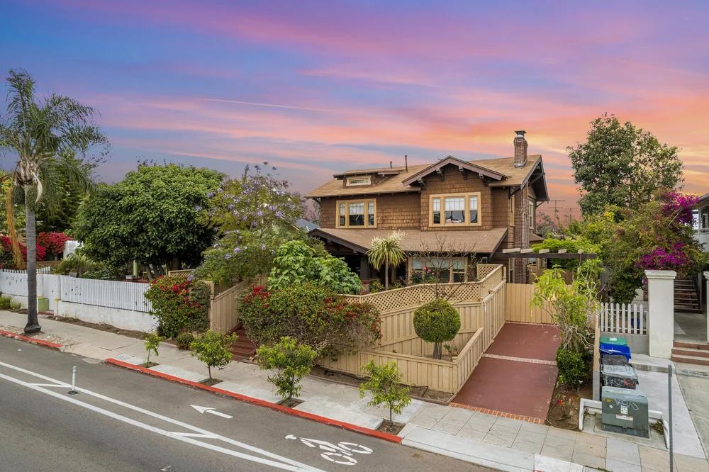 Palm Parkside, a 1911 Craftsman home near Balboa Park in San Diego, with its front steps and garden at sunset