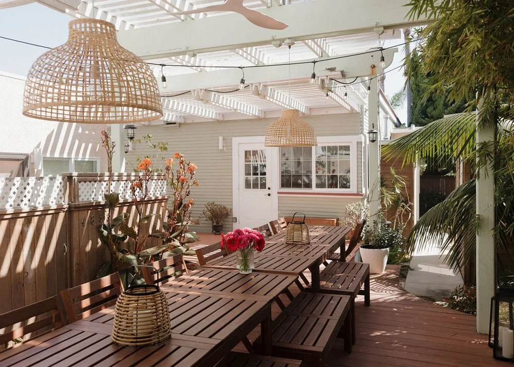 Seaside Square group vacation rental in Ocean Beach San Diego, the shared courtyard set for dinner under string lights
