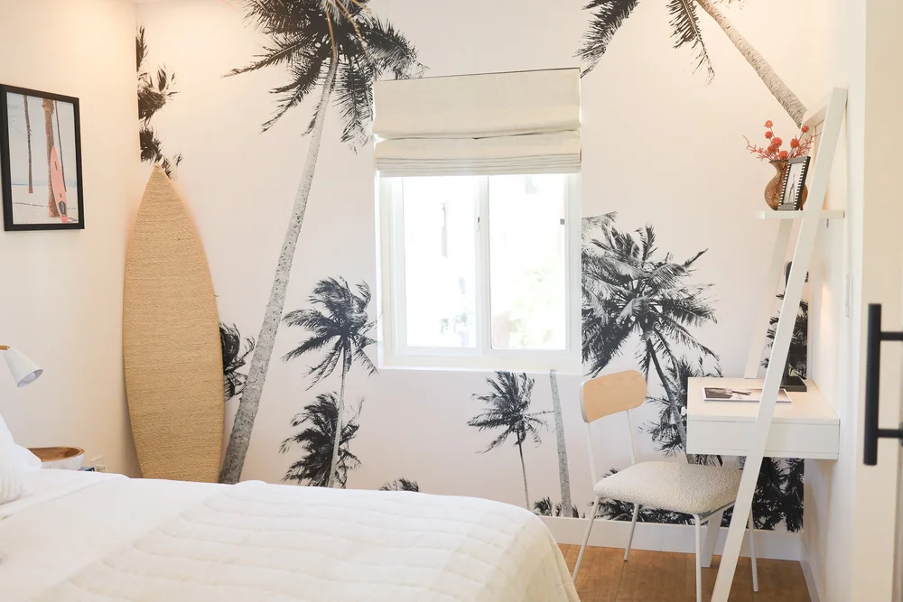The palm mural in the bedroom in Unit Three at The Swell, Oceanside