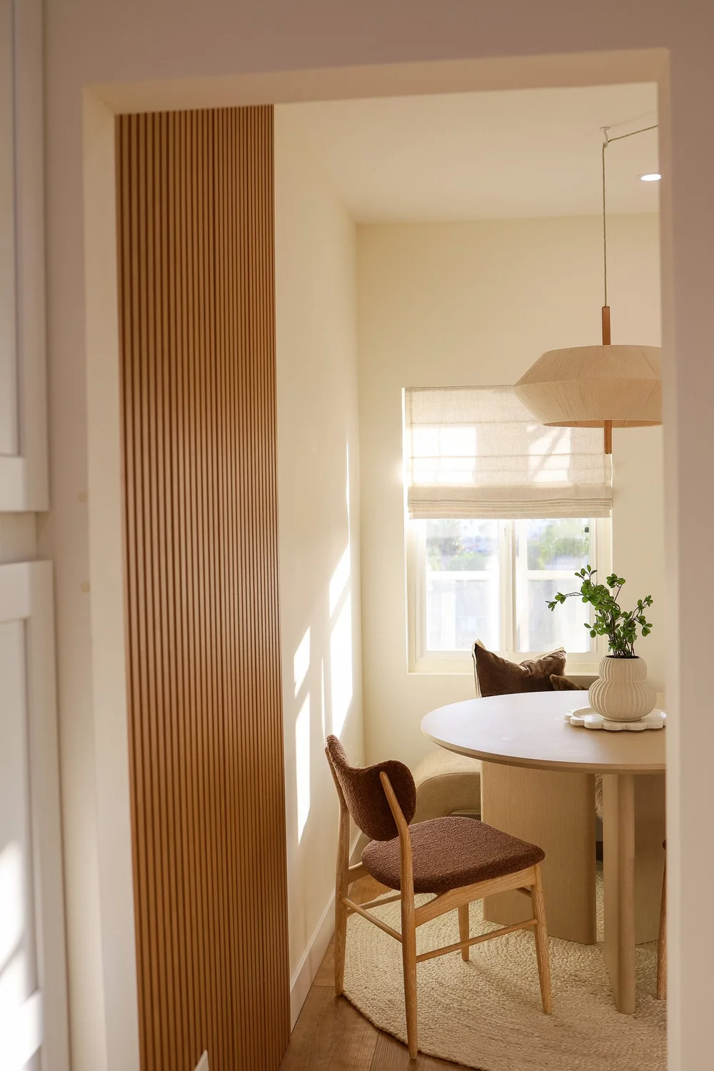The dining nook by the window in Unit Three at The Swell, Oceanside