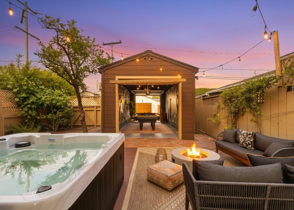 Palm Parkside near Balboa Park, the back garden at dusk with a hot tub, fire pit and a pool table in the garage