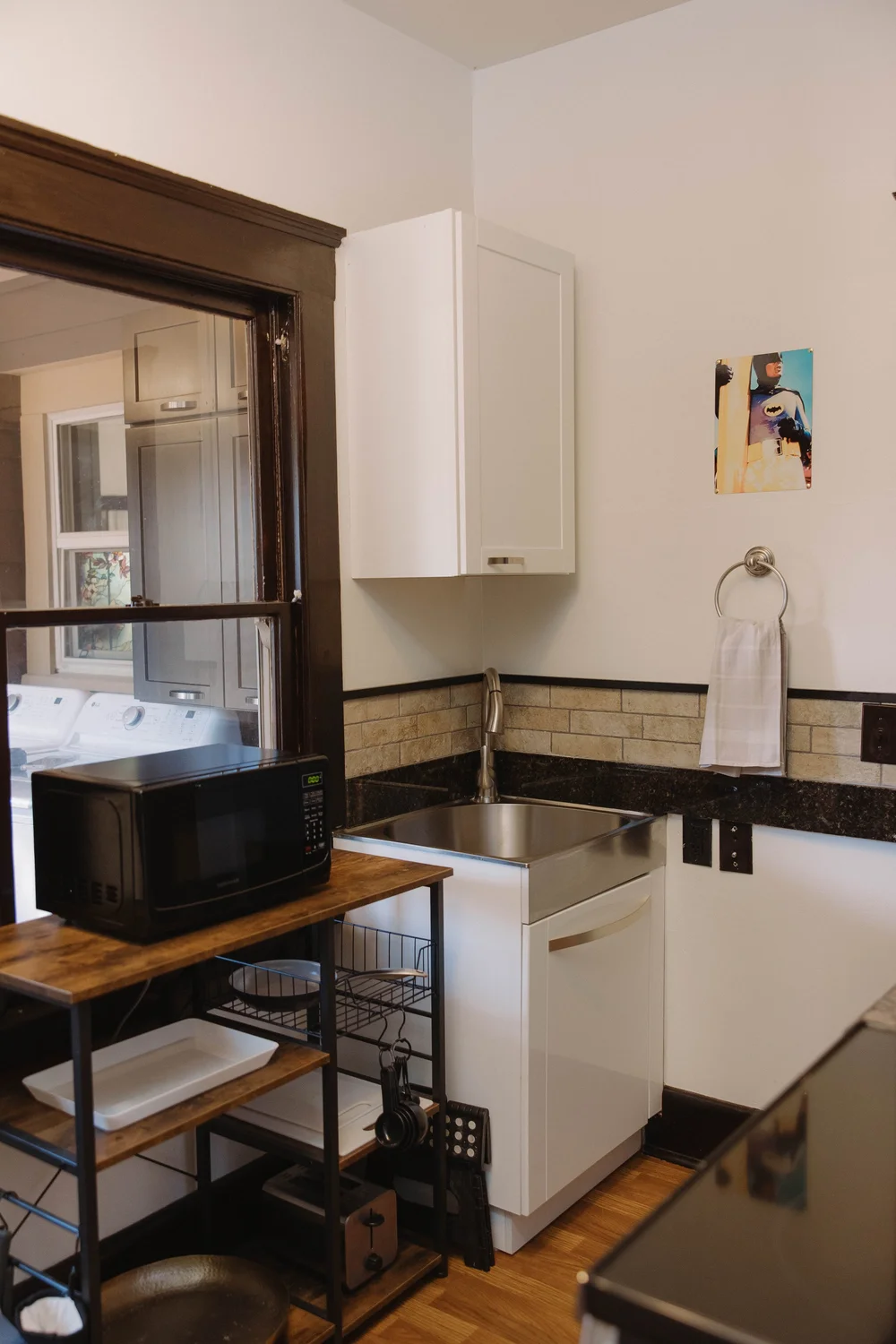 The sink, microwave and coffee station in the second kitchen on the first floor at Palm Parkside