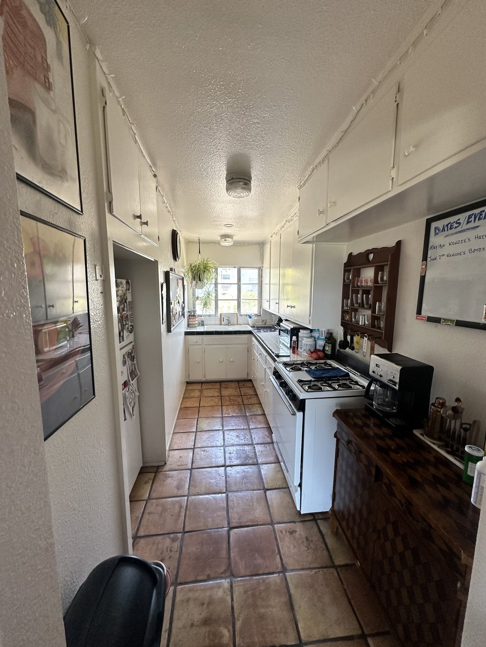 Before: Galley kitchen from the doorway at Clementine C in Oceanside