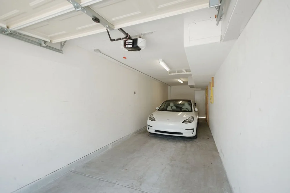 The private garage with an EV charger for The Sandbar studio at Seaside Square