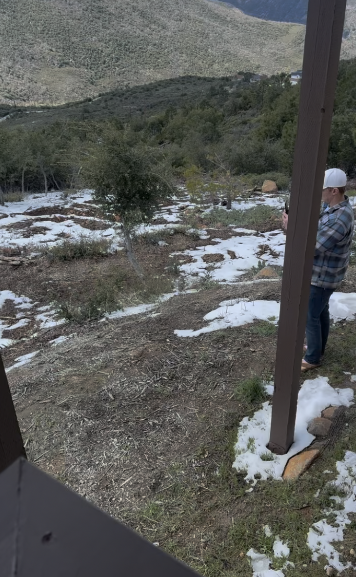 Before: snowy hillside beside the house
