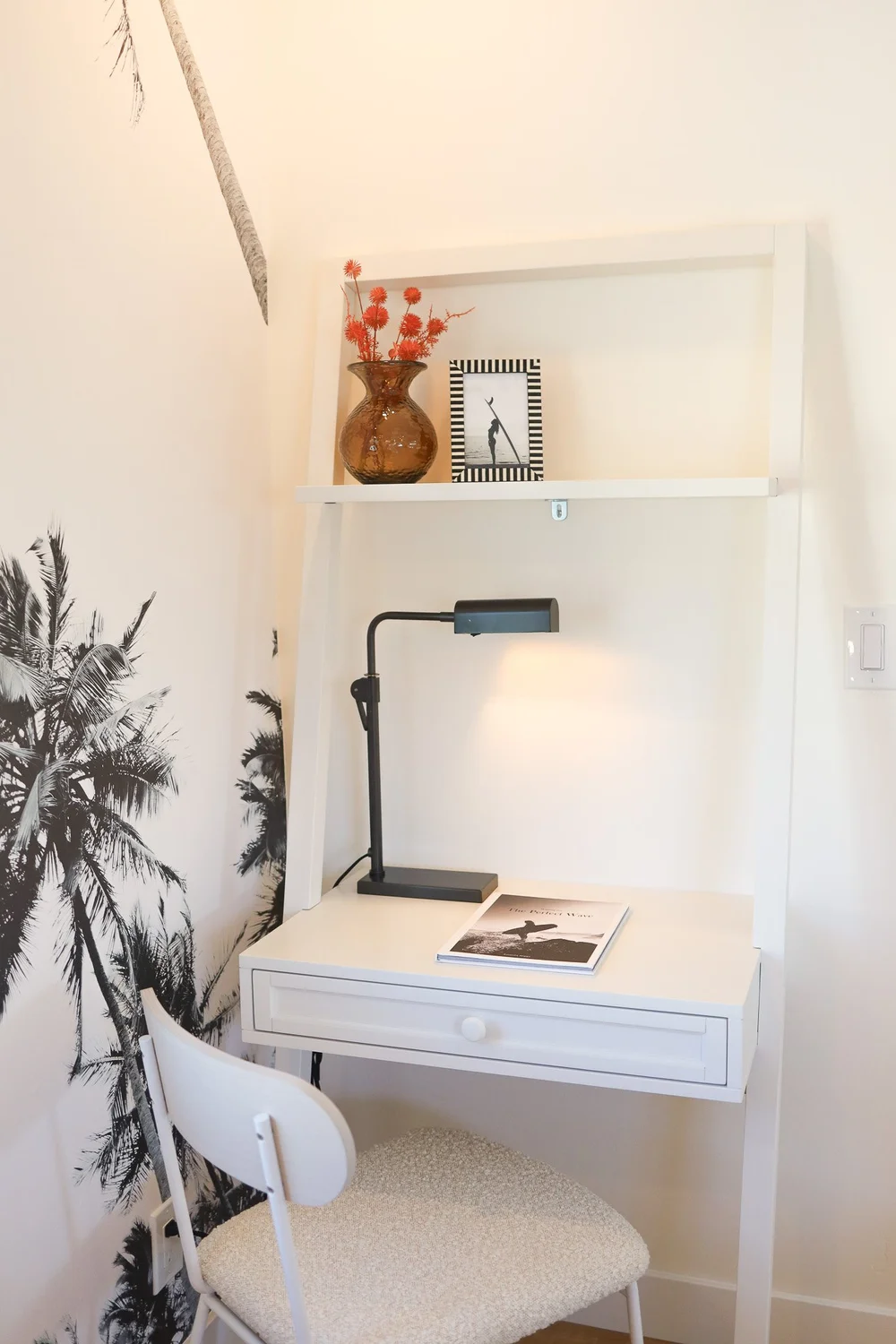 The desk with a lamp and a chair in Unit Three at The Swell, Oceanside
