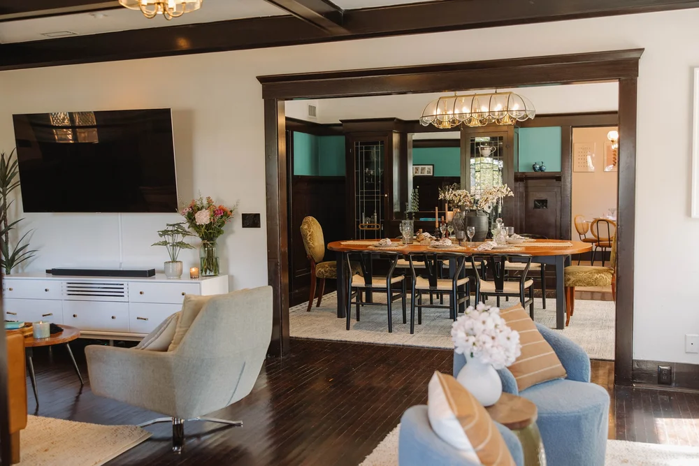 The living room opening to the dining room at Palm Parkside