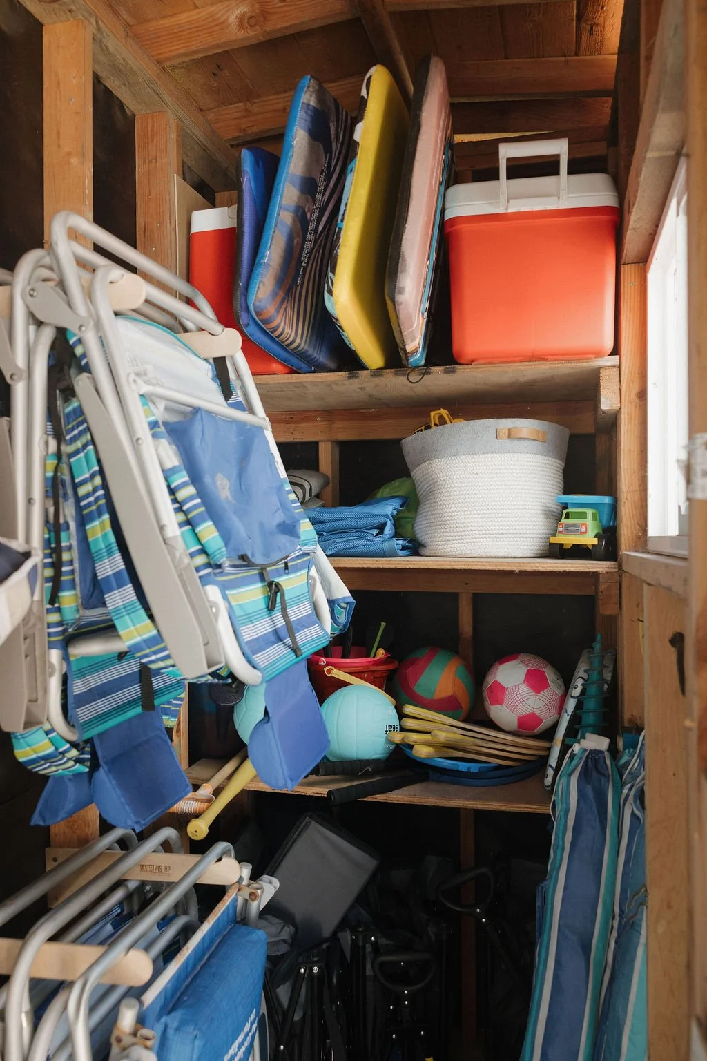 The beach shed at Seaside Square stocked with beach chairs, umbrellas, boogie boards, a cooler and sand toys