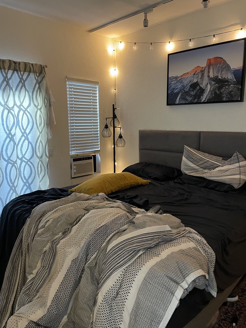 Before: Bedroom with string lights at Velvet Surf in Pacific Beach