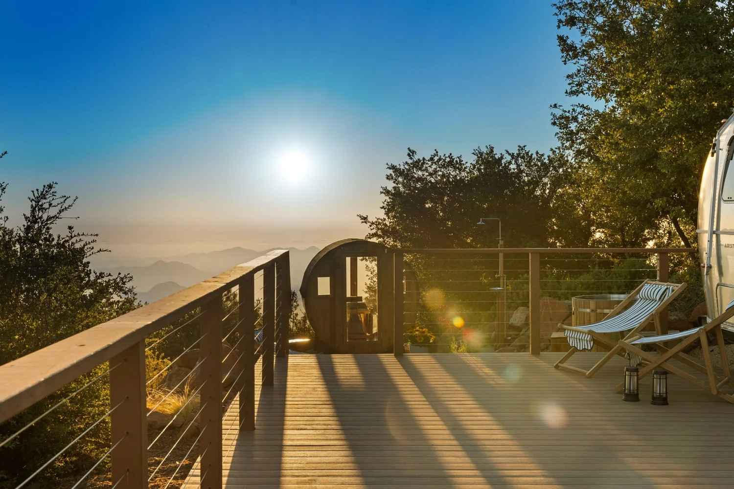 Airstream deck with mountain views at sunrise, a wellness retreat space near Julian