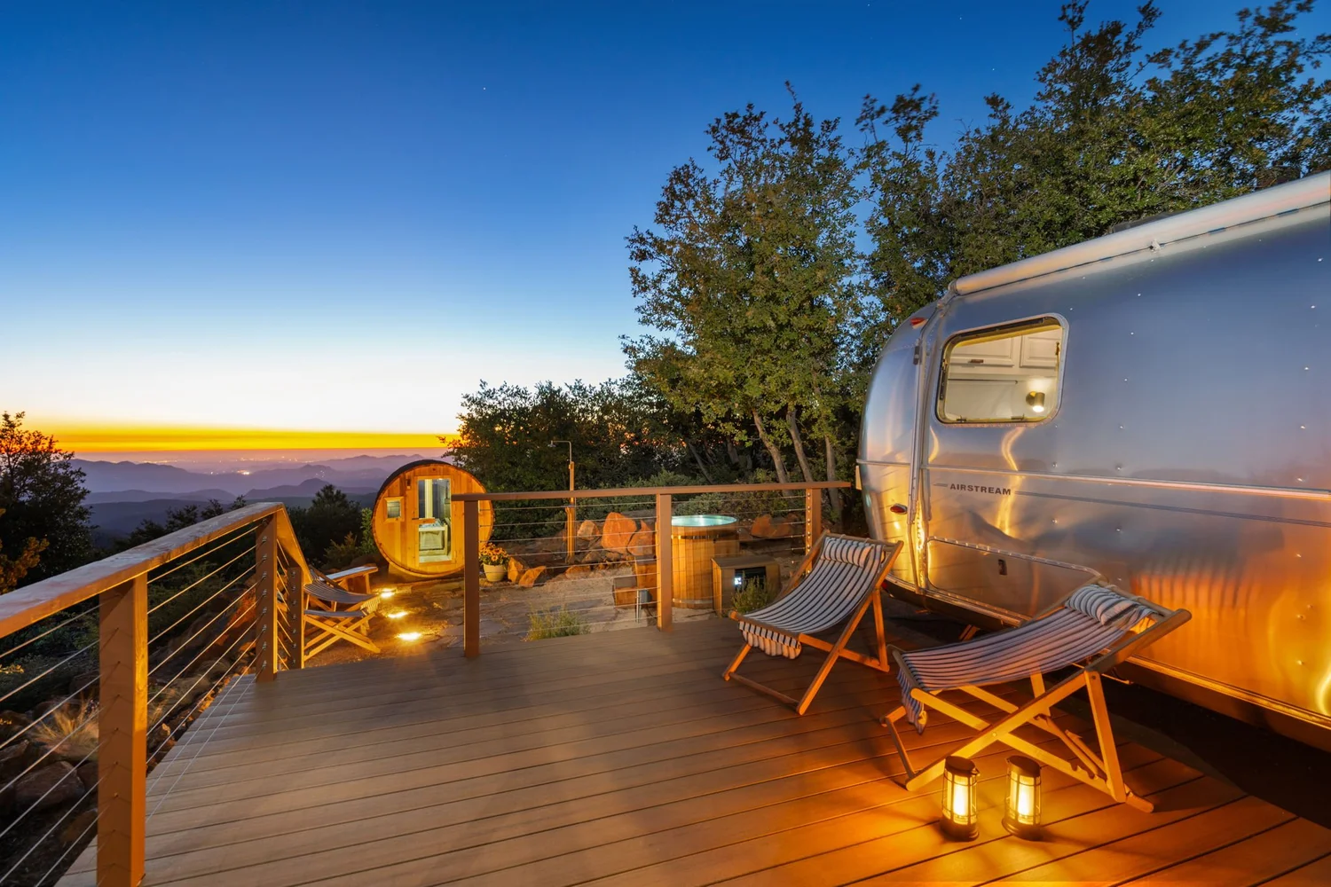 Lounge deck between the Airstream and the sauna at dusk