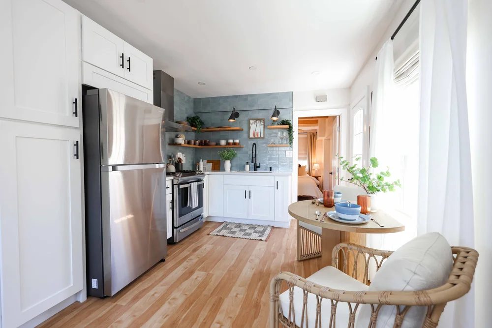 The full kitchen and dining area in Unit Two at The Swell, Oceanside