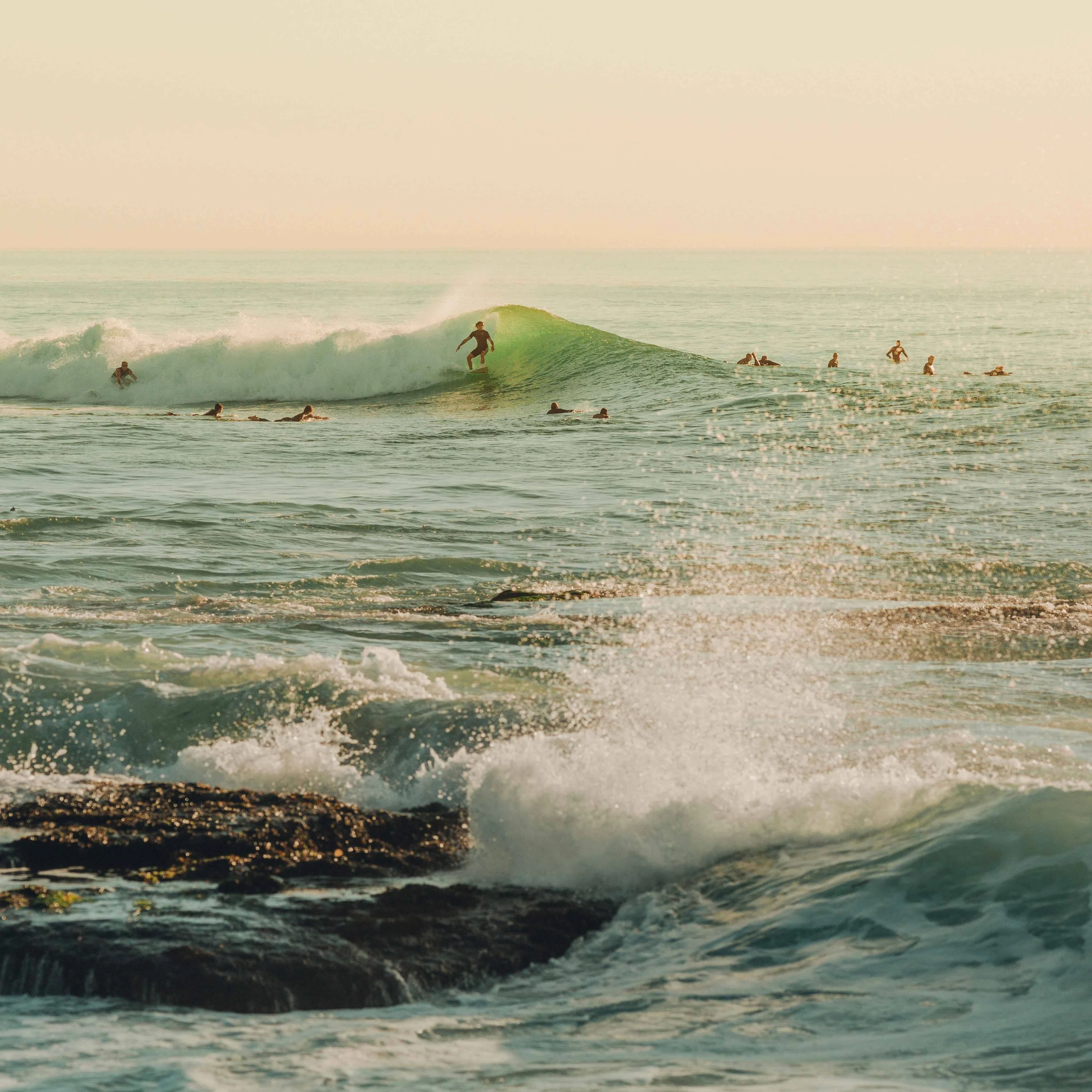 A surfer riding a wave at Windansea Beach in La Jolla