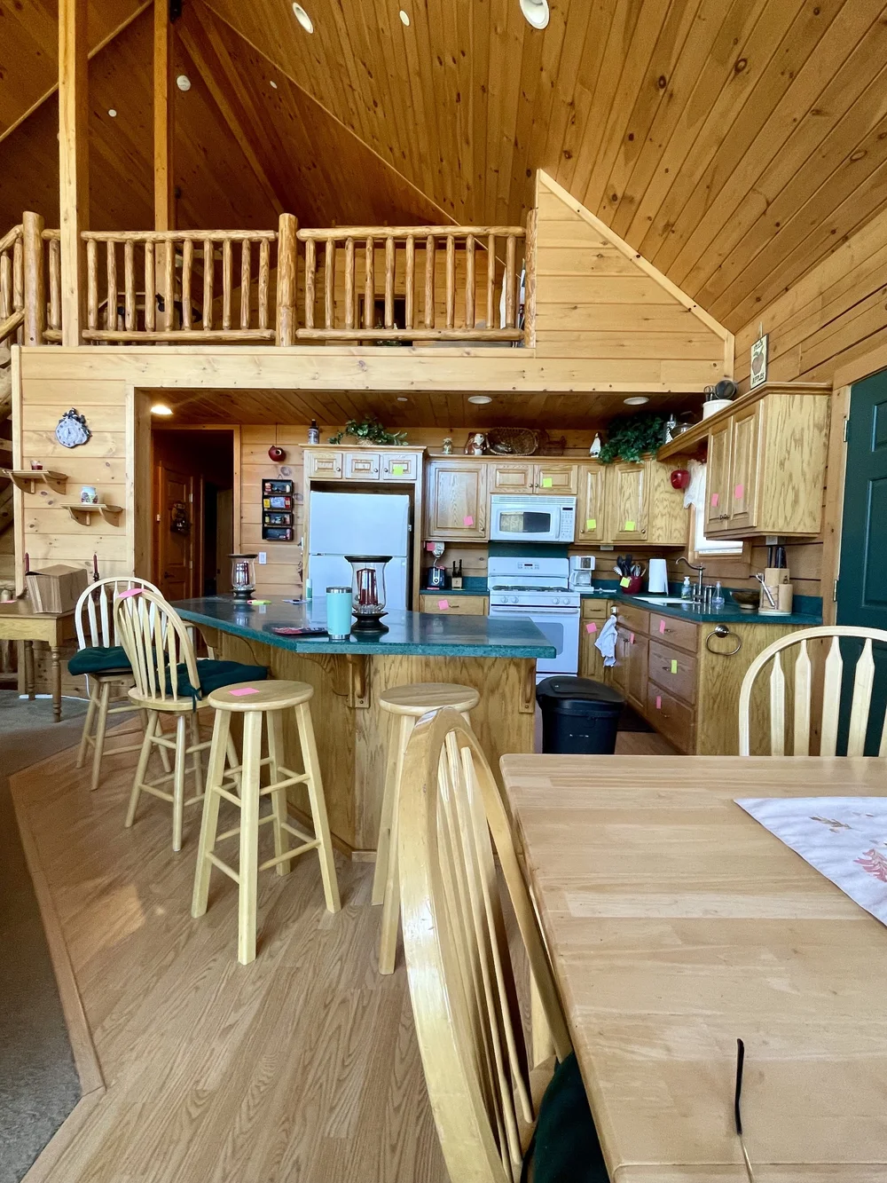 Before: Kitchen bar and dining table at Dark Moon Chalet in Julian