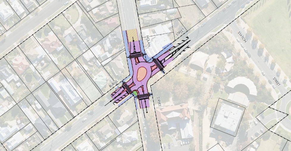 A detailed urban planning map showing street layouts, crosswalks, and zoning features at an intersection, with surrounding blocks and an adjacent park area.