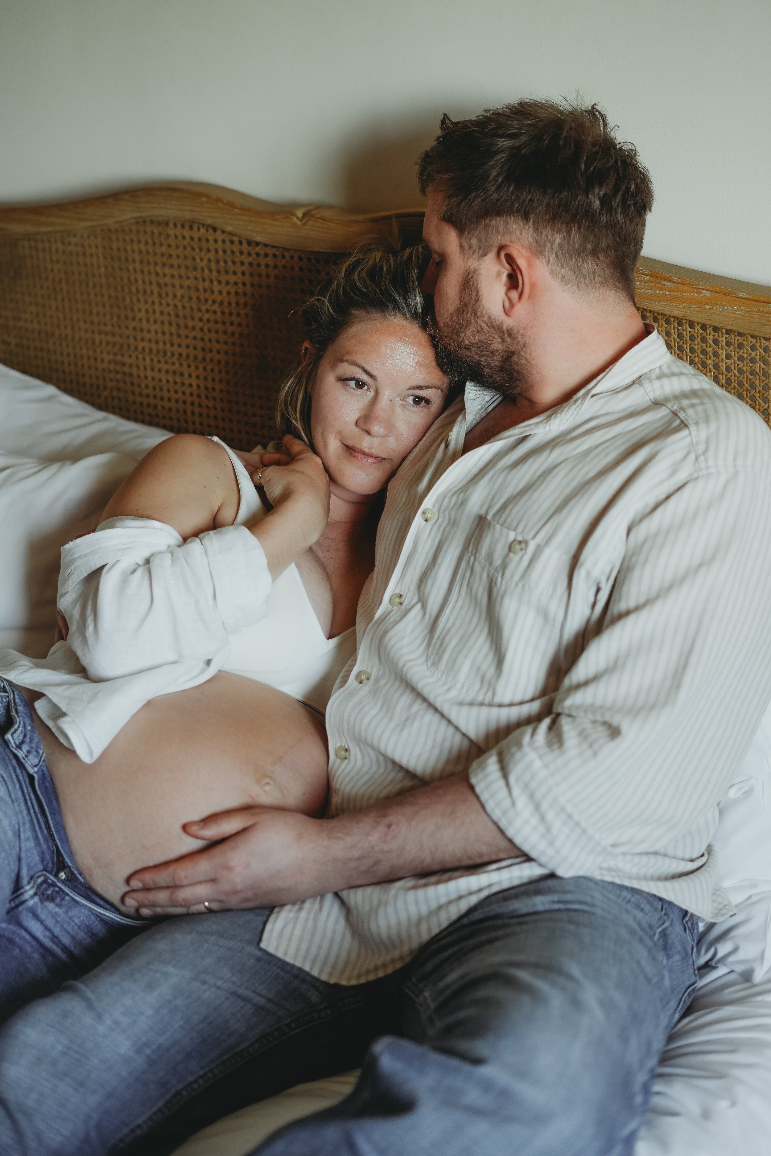 A Candid moment of an expectant mum and dad during a natural maternity photoshoot