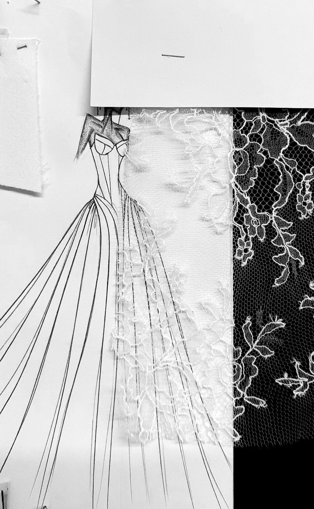 Design sketch of a wedding dress with lace fabric and floral embroidery.