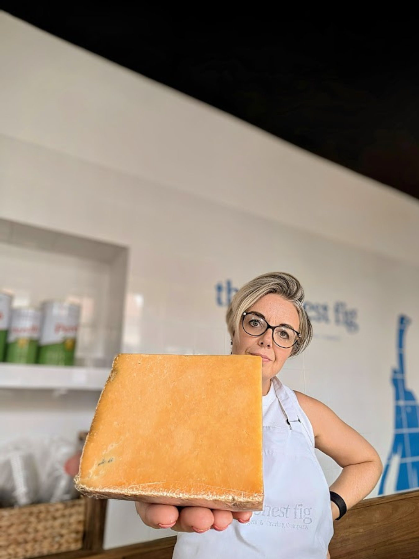 Linda Holding a Big Block of Cheese
