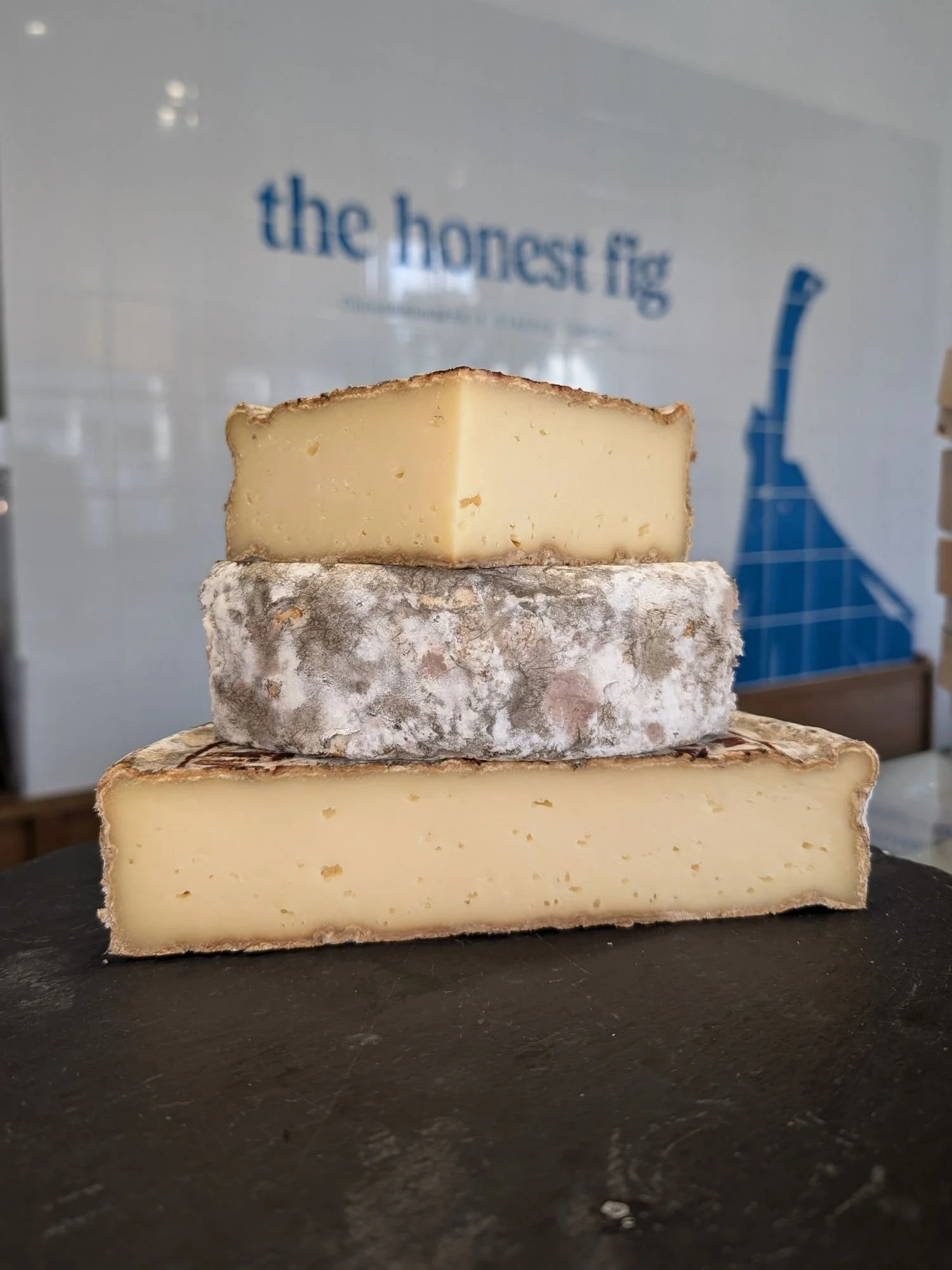 Piled up Colooney Cheese in the Shop