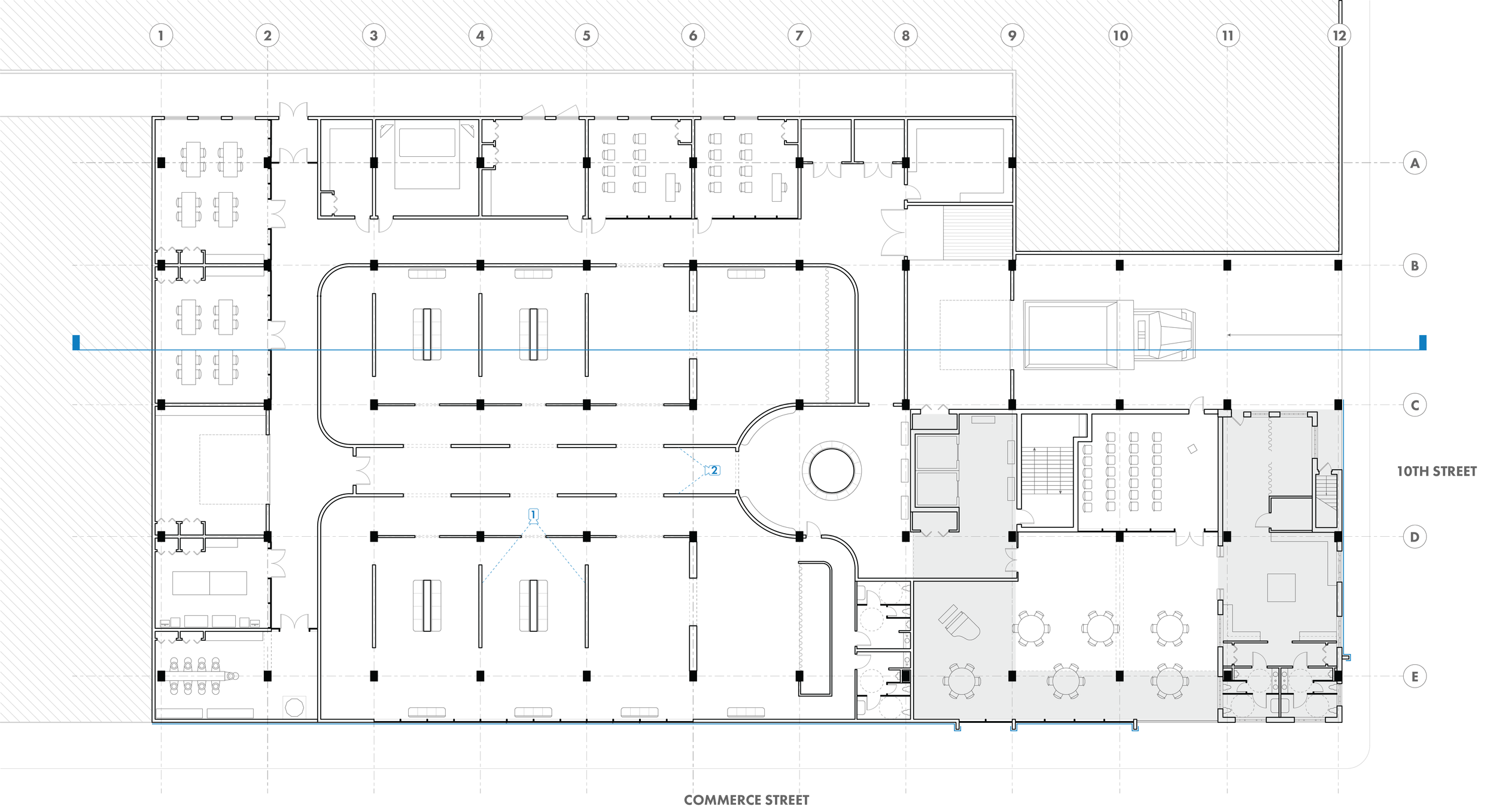 Black and white floor plan shows museum floor with two large gallery spaces, studios lining the permiter, a loading dock, and a large event space.