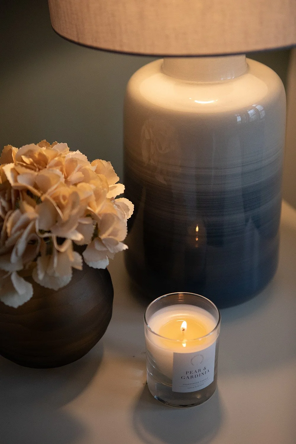 Interior photograph of a slow-living inspired bedroom — curated to feel like a sanctuary. Organic colour palette and artisan details throughout.