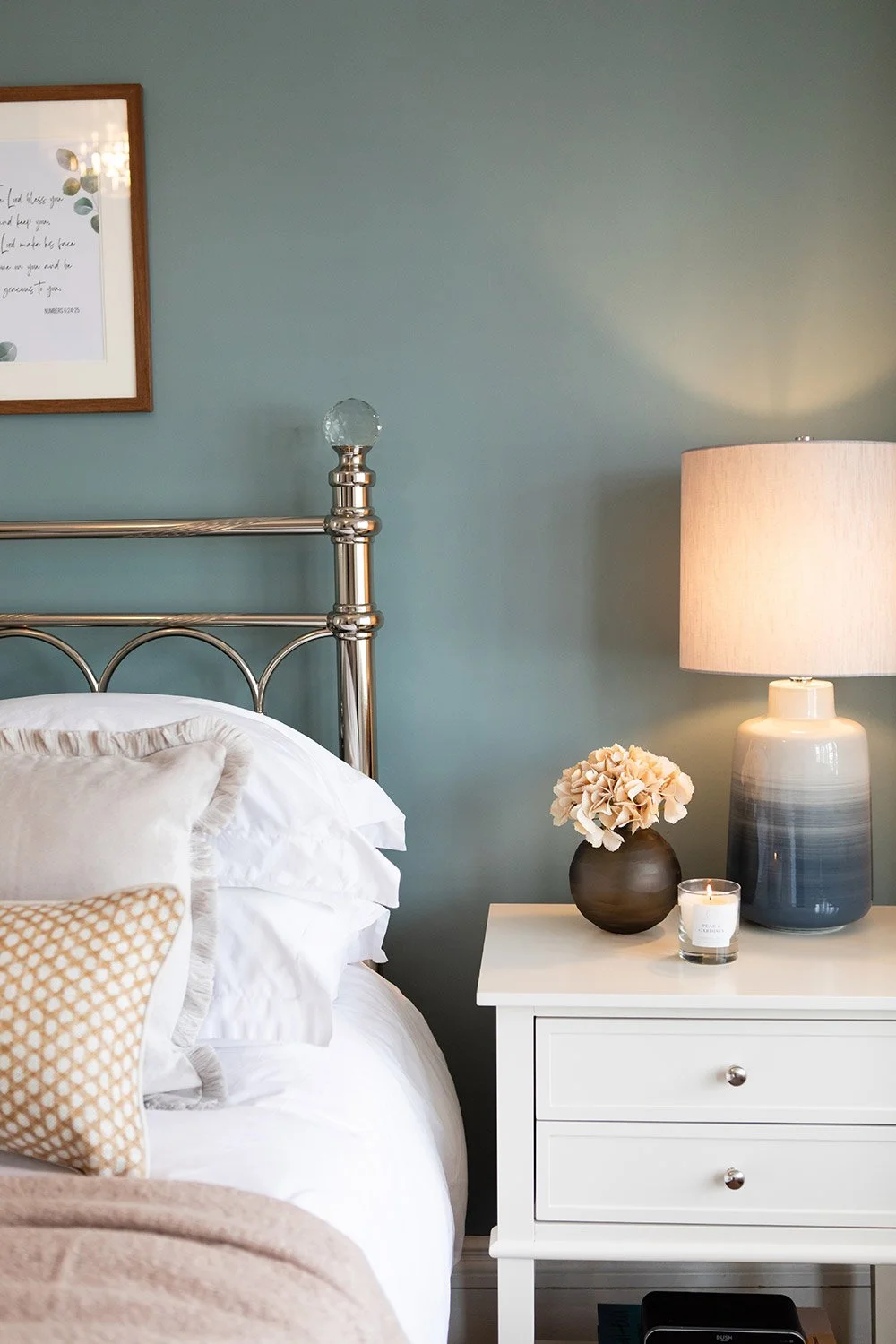 Interior photograph of a slow-living inspired bedroom — curated to feel like a sanctuary. Organic colour palette and artisan details throughout.
