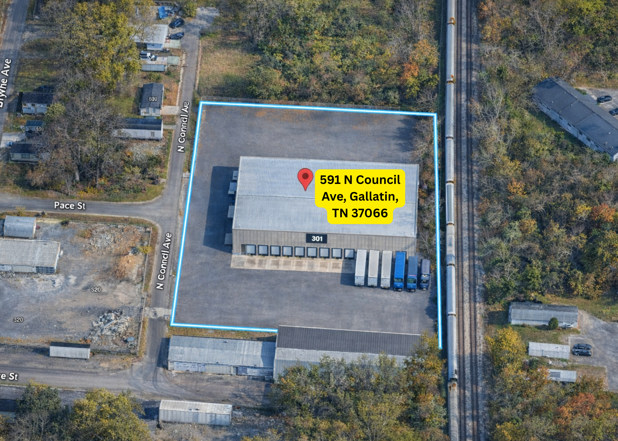 Aerial view of Tour Entertainment Transportation’s secure logistics and storage facility in Gallatin, Tennessee, featuring a fenced yard, warehouse space, and parking for semi trucks and production trailers. This location supports touring equipment s
