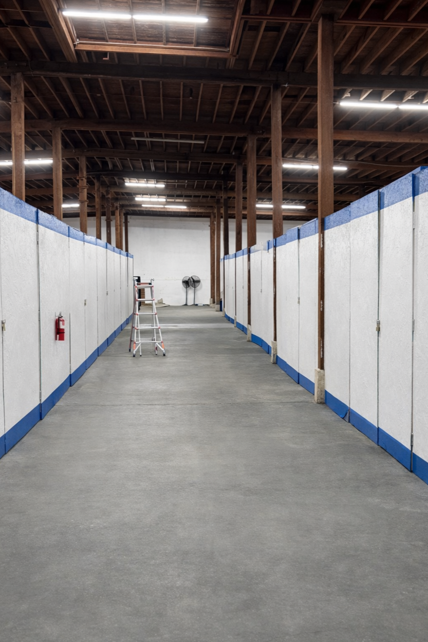 Inside Tour Entertainment Transportation’s secure indoor warehouse with private band storage lockers and staging space for touring production equipment.