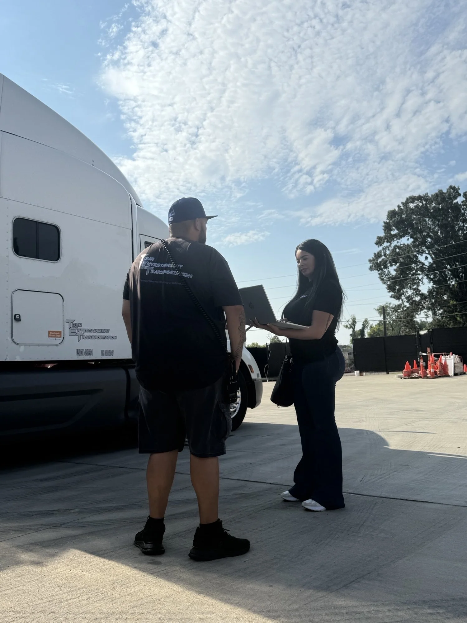 Tour Entertainment Transportation COO coordinating loads and tour trucking logistics with TET lead driver on site