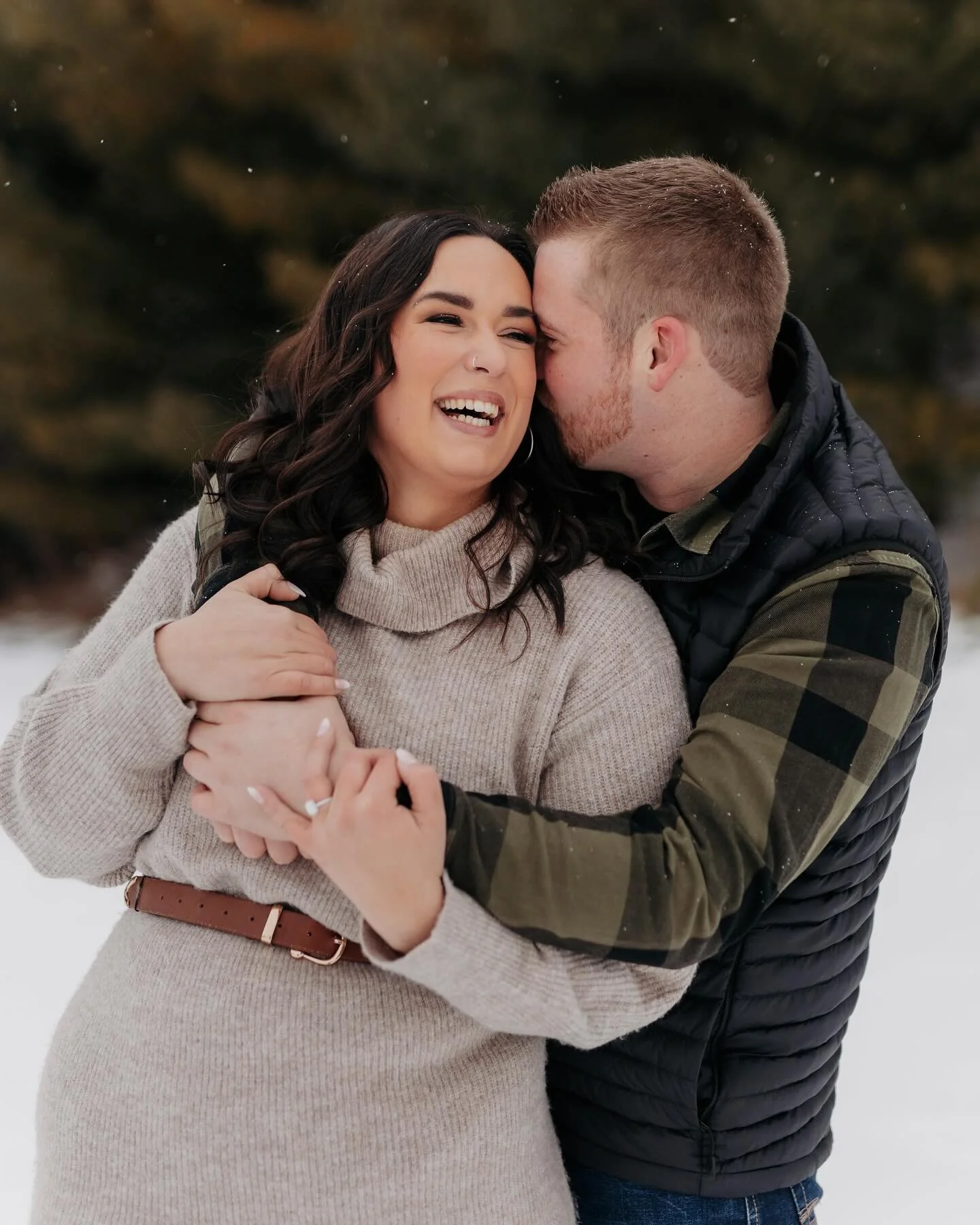 Fun in the snow while we had it. We had such a great time during this engagement session, and I can&rsquo;t wait for their wedding this summer!!
If you want a photographer who likes to have fun and get you rolling in some snow during your session, I&