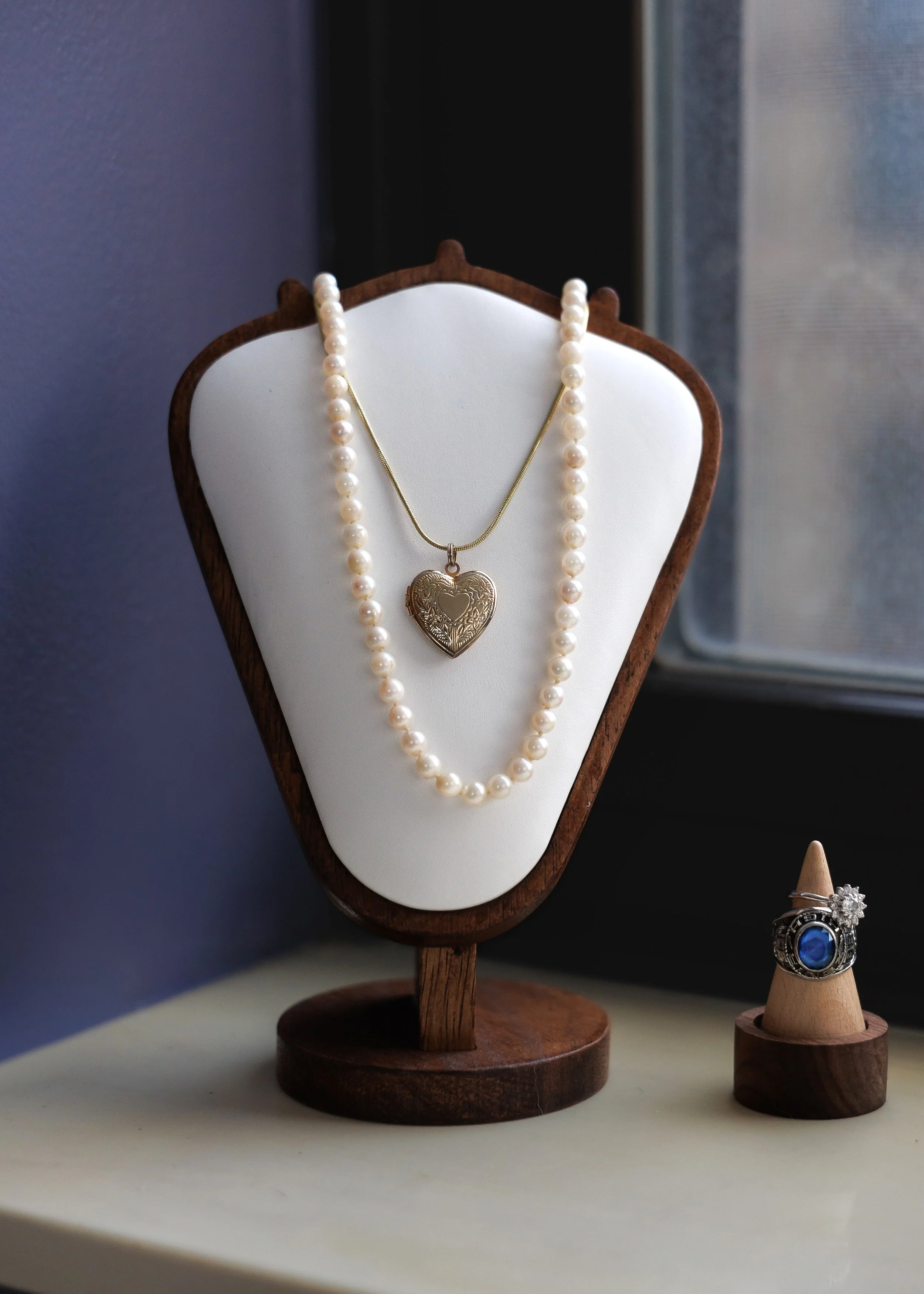 Heart-shaped locket necklace that inspired Lovers Locket Photography, a sentimental piece representing love, memory, and meaningful stories kept close