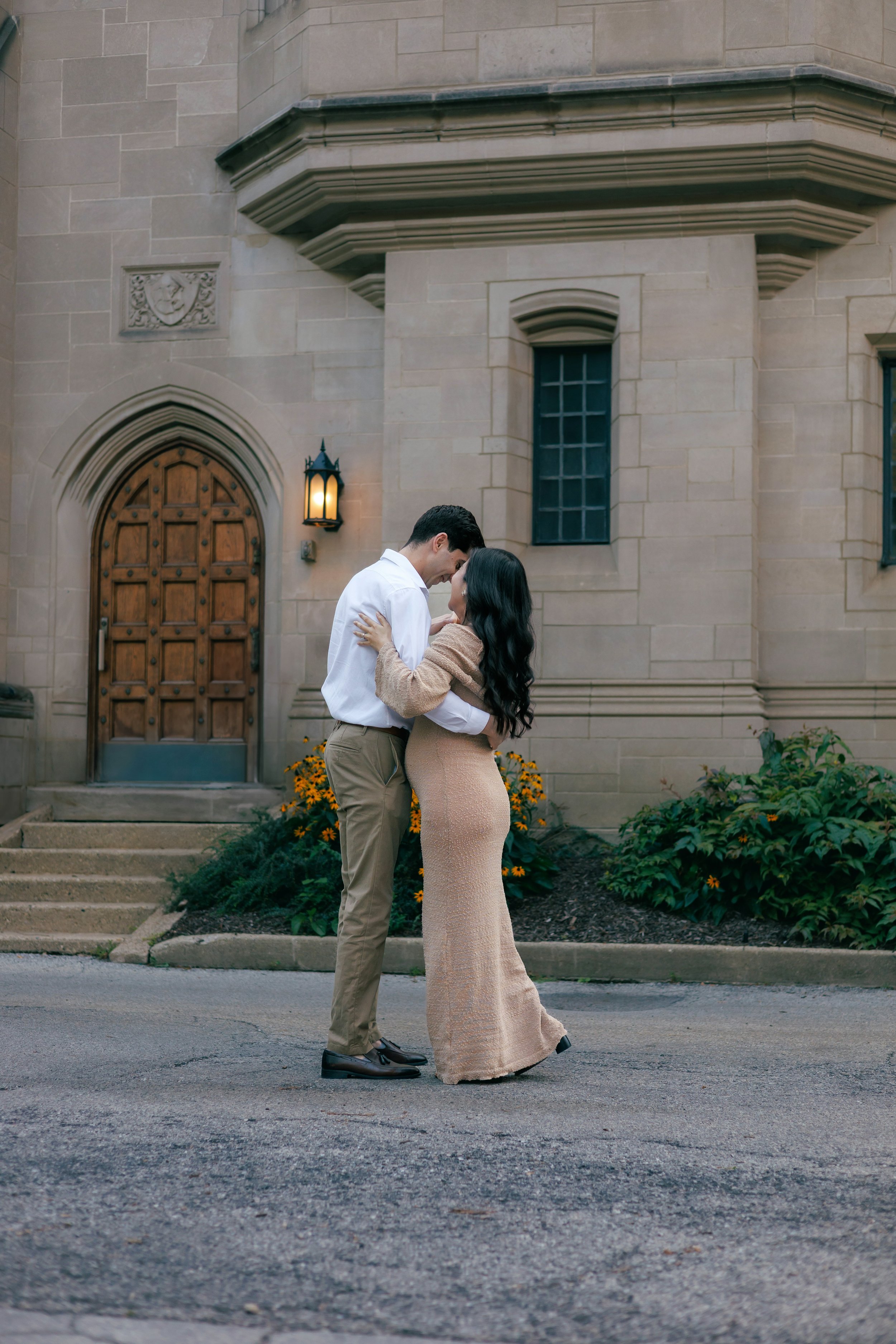 Chicago maternity photographer capturing a pregnant woman in a white lace dress standing beside a tree, peaceful and intimate outdoor maternity portrait with natural light