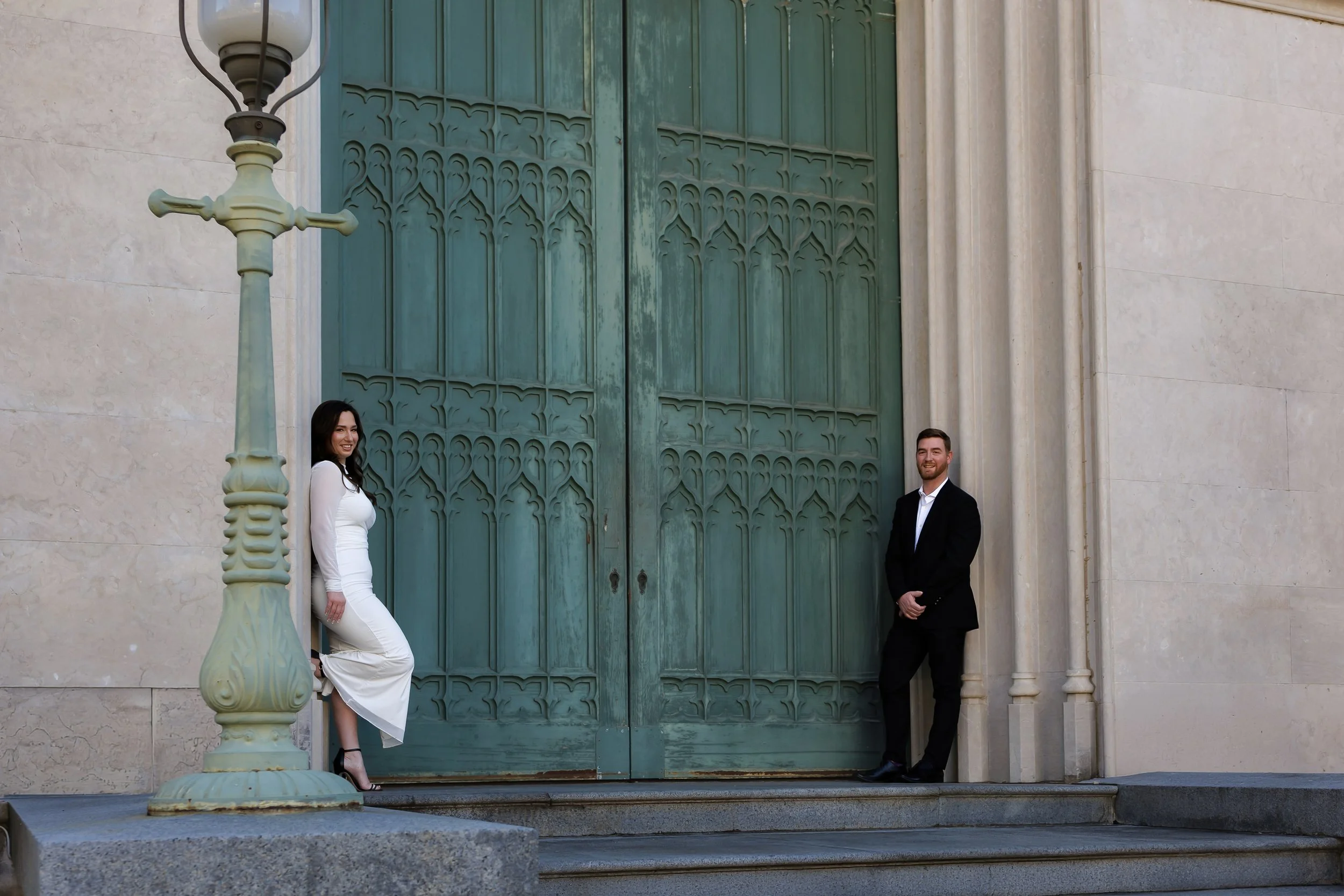 Chicago photographer captures couple standing on the sides of a ornate door