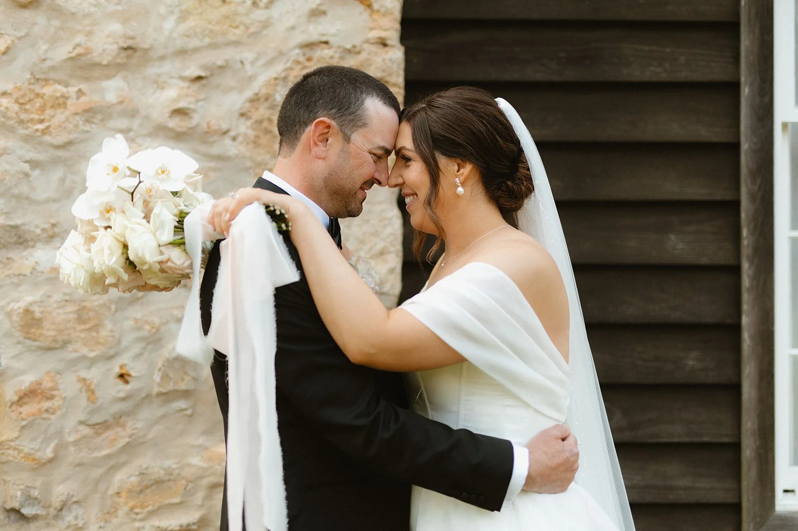 Our Bride Danielle wearing her custom heirloom wedding veil. Featuring her mother's bridal veil's embroidery and modern pearls.

Taylah Jayde Photography 