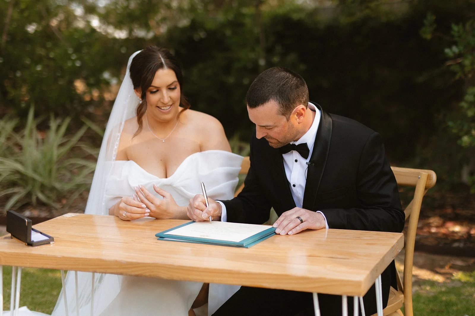 Our Bride Danielle signing her wedding documents, wearing her custom heirloom bridal veil.

Taylah Jayde Photography 